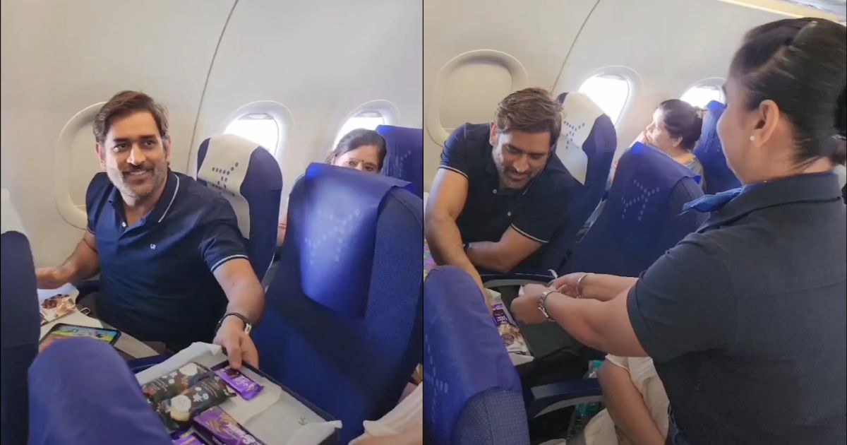 air hostess offers a chocolate tray to MS Dhoni.